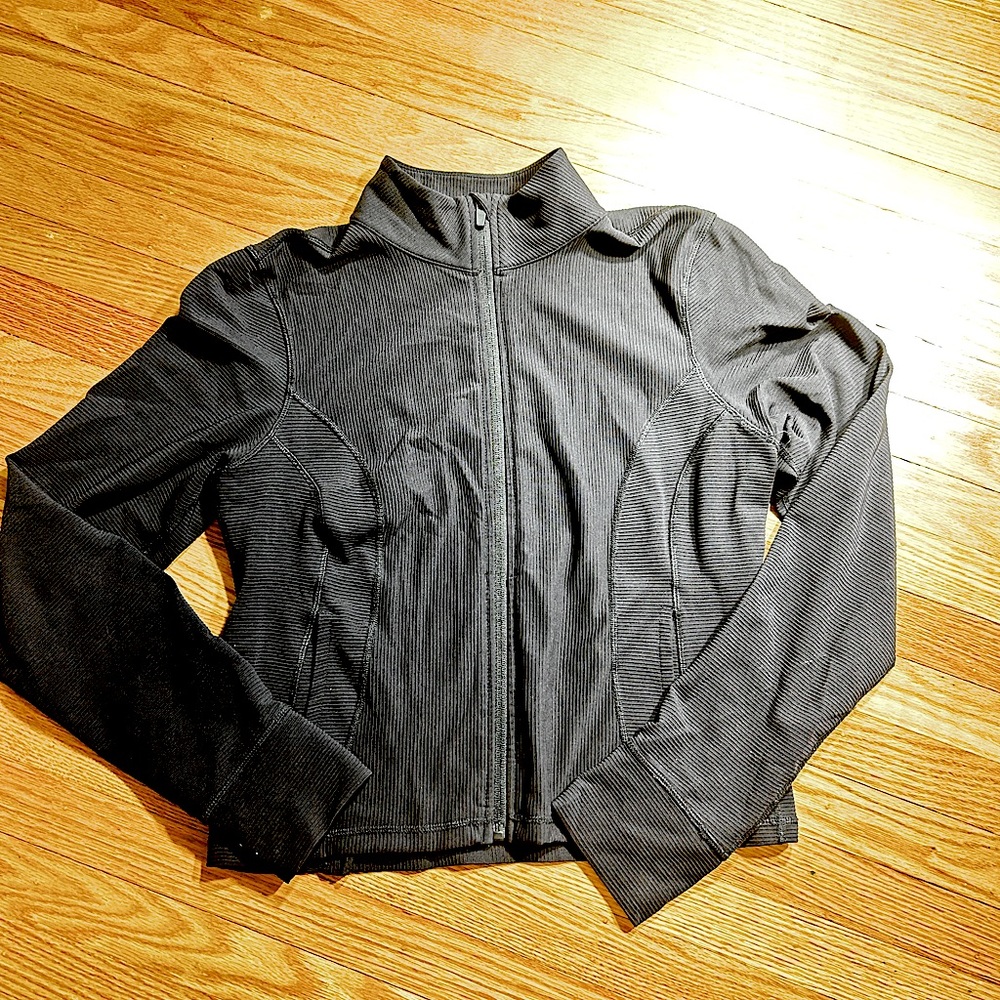 Amazon Brand. Black zip up with thumb holes. Size Large.